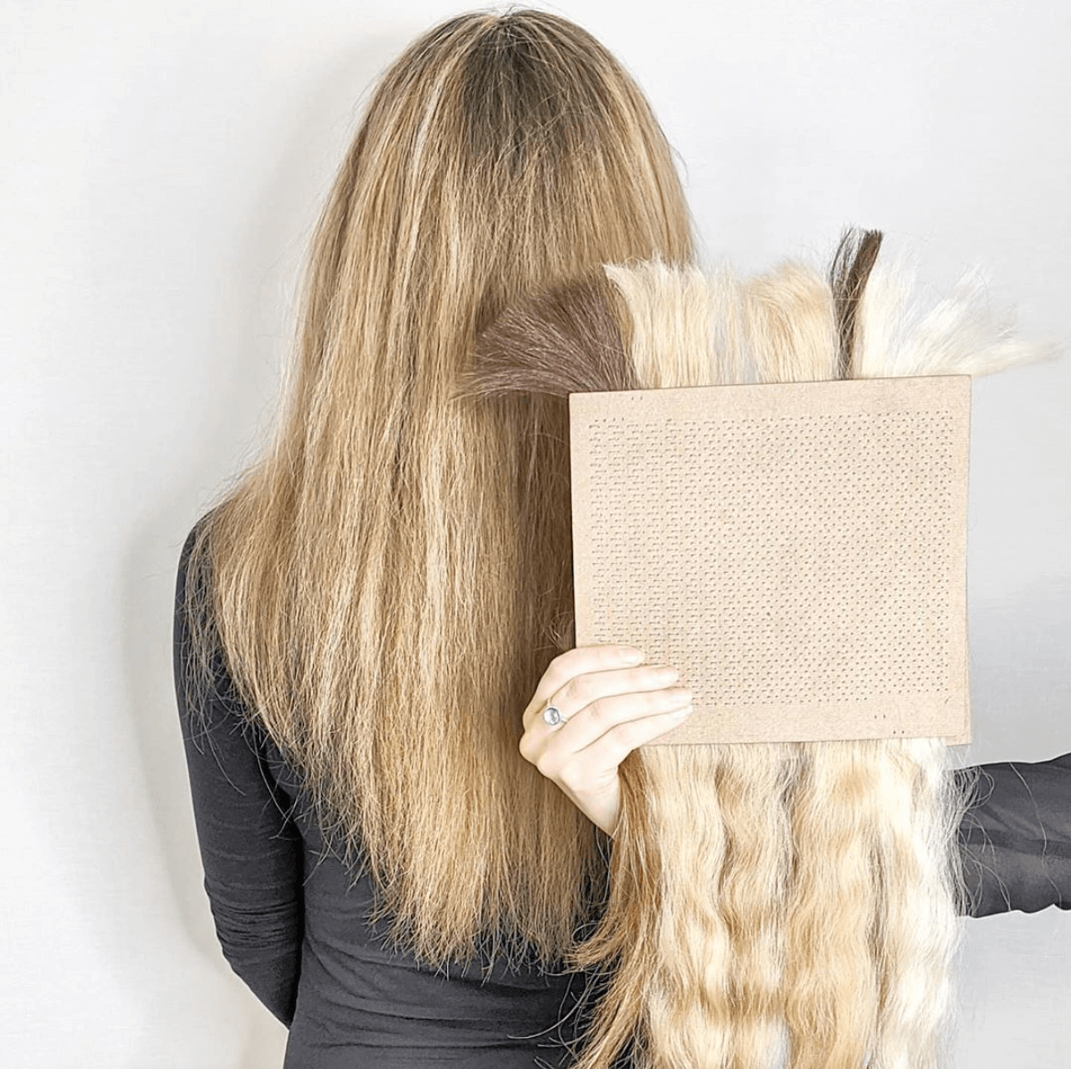 Colour matching blond hair extension to real hair