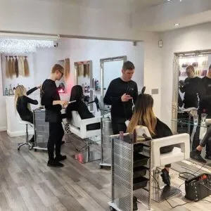 hair technicians and clients in salon